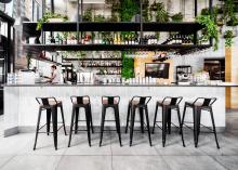 A bar with high table chairs
