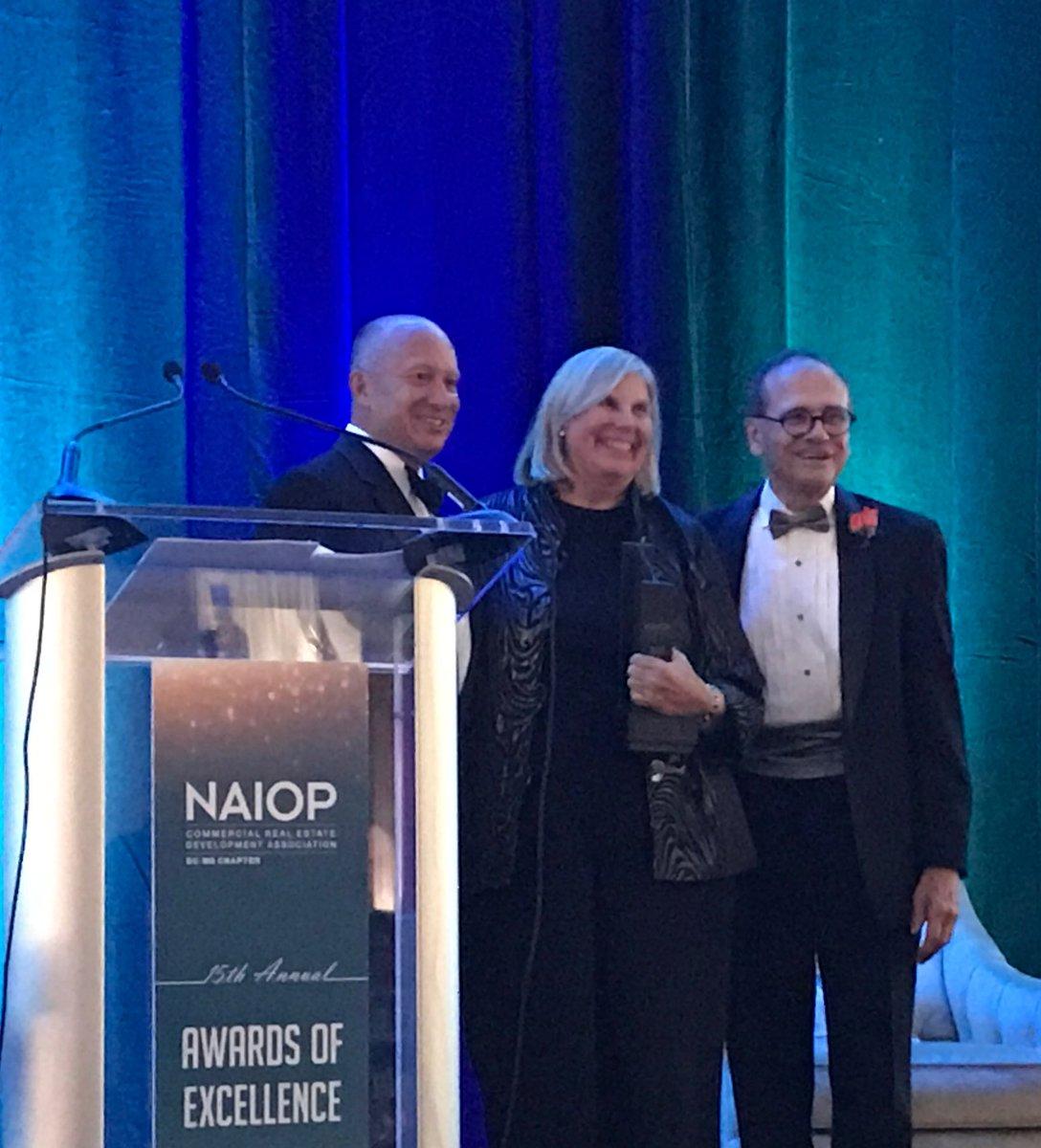 Caption: Dr. Margaret McFarland with NAIOP chapter president Tim Zulick (left) and David Kitchens, Principal, Cooper Carry Inc. Awards Committee Chair (right).