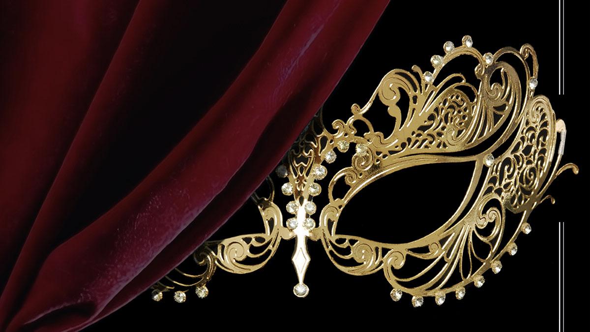 Venetian Mask behind a red velvet curtain