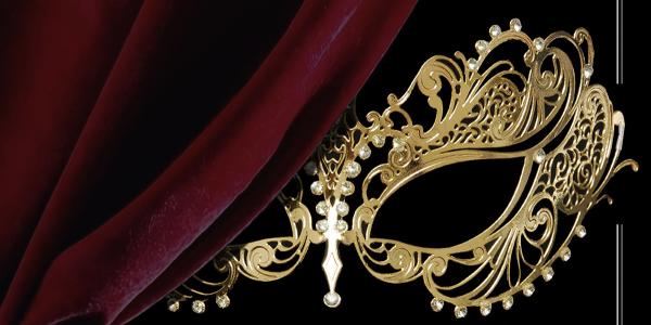 Venetian Mask behind a red velvet curtain