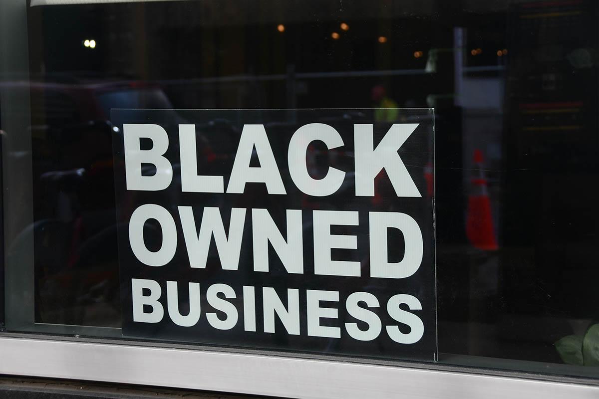 Black owned business sign in window